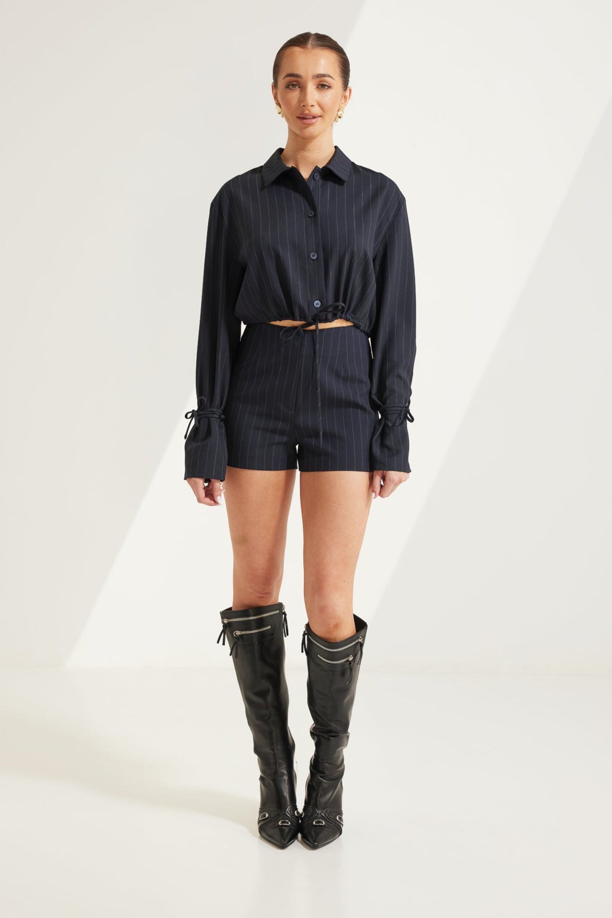 TT9788 Scottie Pinstripe Shorts in Navy/White. Australian women’s WHOLESALE SHORTS. High waisted short in Classic pinstripe pattern. This short come in matching top.