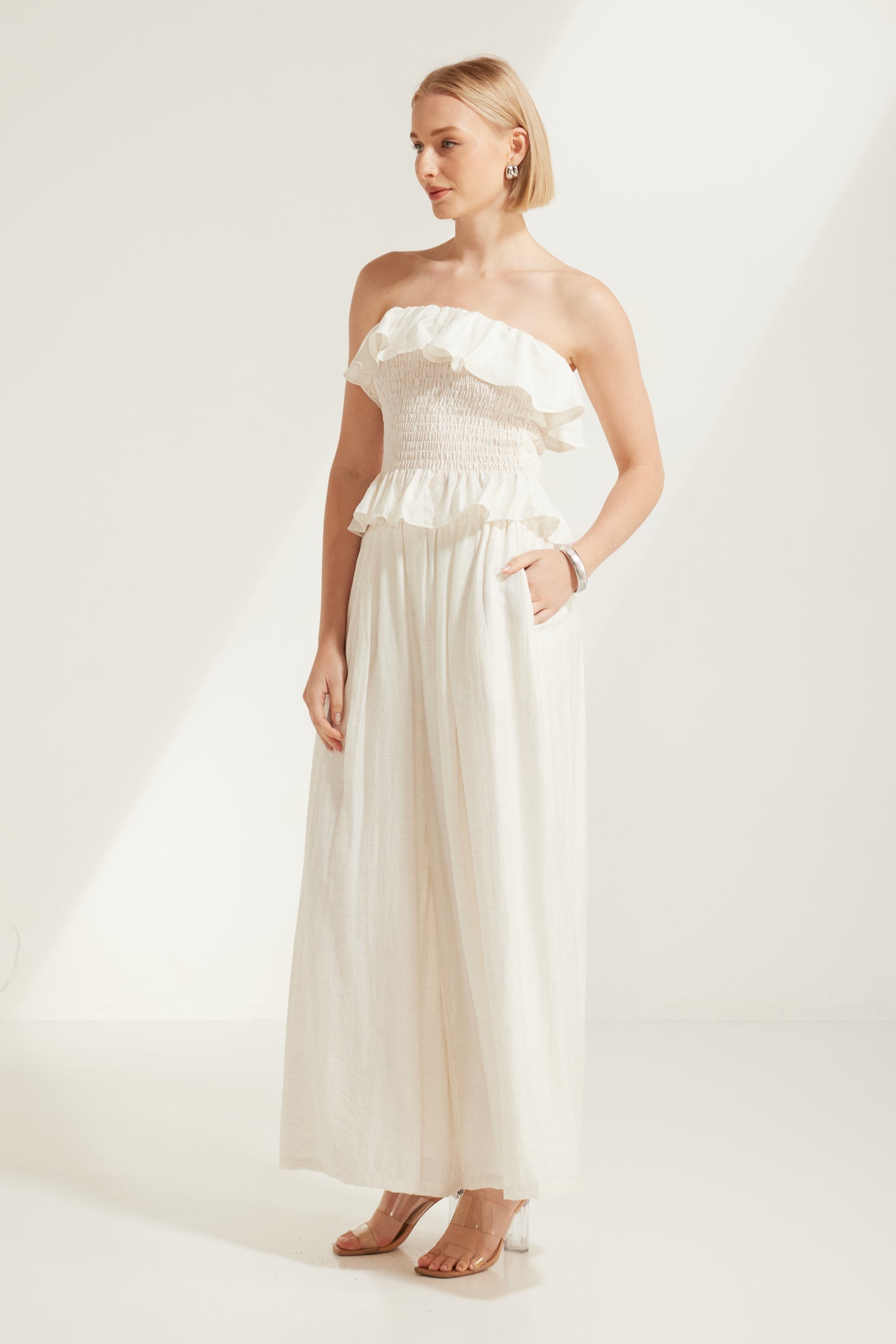 TW4793 Celina Shirred Ruffle Top Natural Ivory. Australian women’s WHOLESALE SLEEVELESS TOPS. Matching set come in Shirred body top and wide leg pant.
