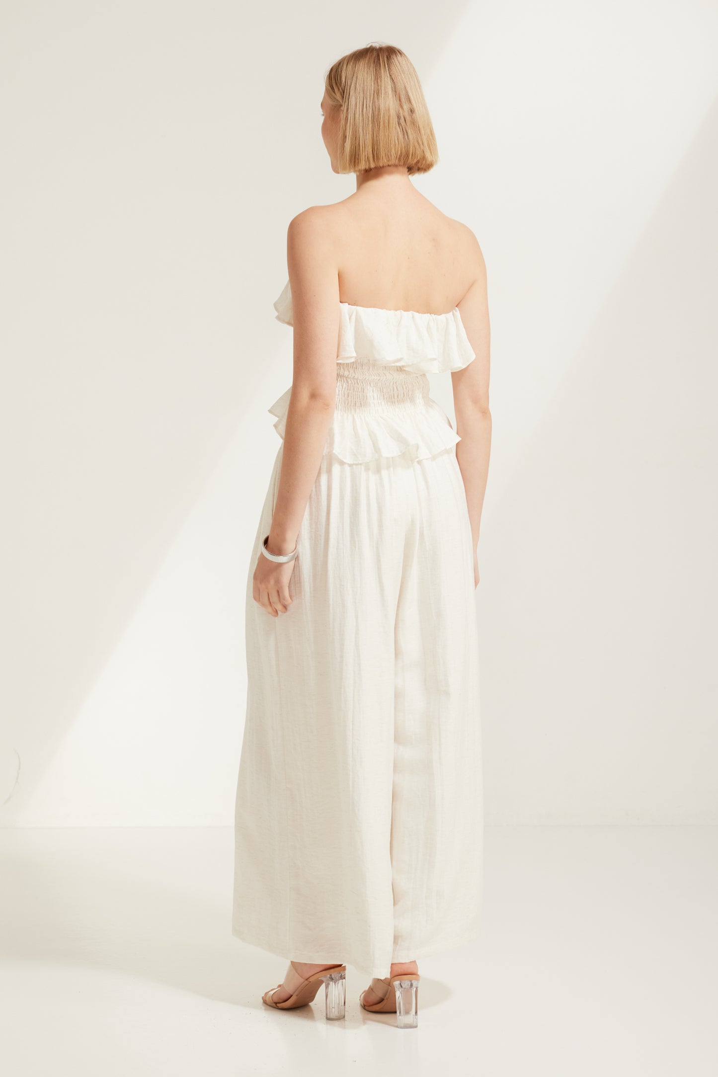 TW4793 Celina Shirred Ruffle Top Natural Ivory. Australian women’s WHOLESALE SLEEVELESS TOPS. Matching set come in Shirred body top and wide leg pant.