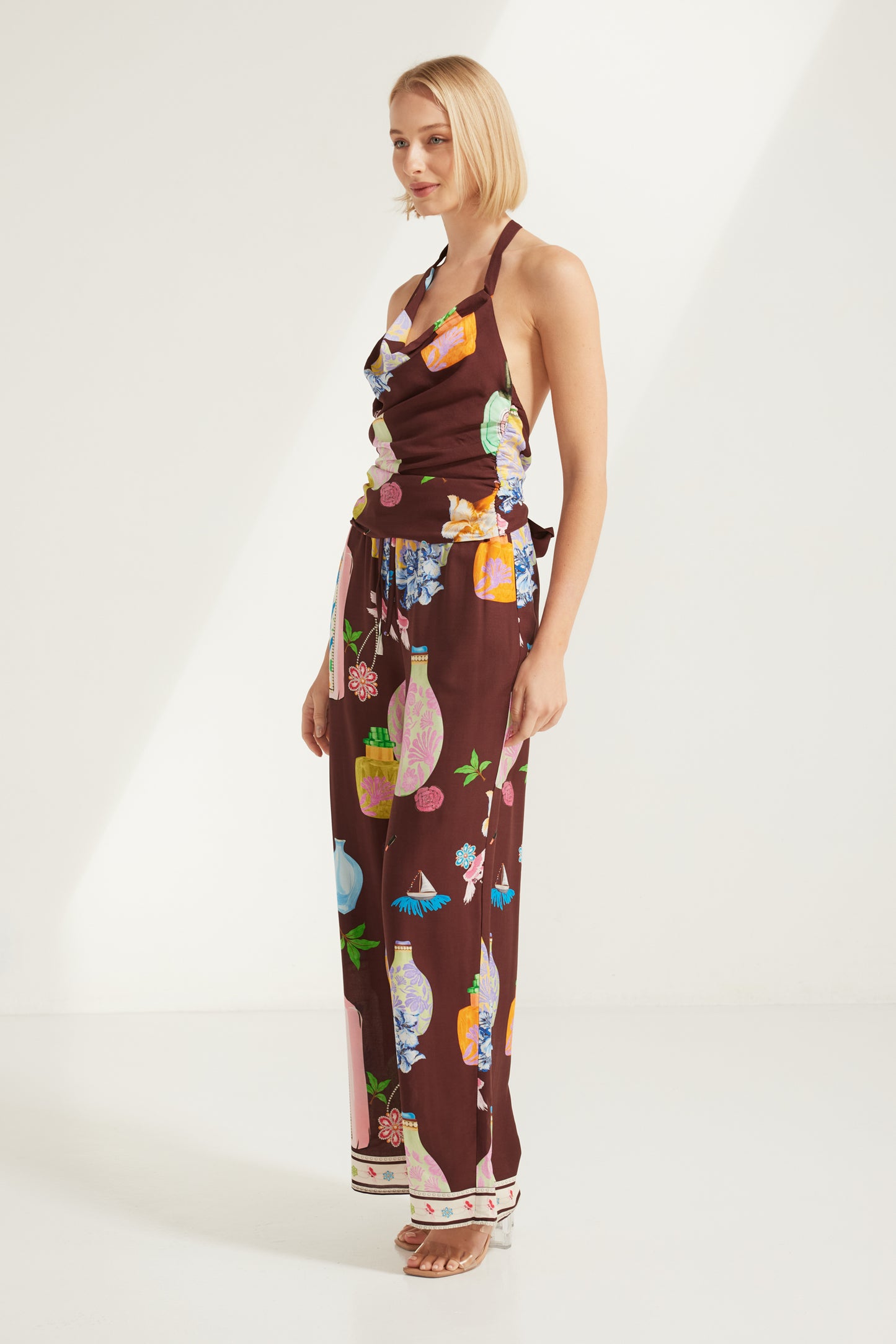 TW4856A Perfume Dreams Halter Neck Top Chocolate Print. Australian women’s PARAISO WHOLESALE FASHION COLLECTION fashion from Rosebullet the label. Paraiso is a fresh new label designed for the dreamers, the beach lovers, and the laid-back souls. Inspired by the feeling of being on holiday, we create breezy, relaxed pieces that are easy to wear and made to flatter every body and inspire confidence in every moment.