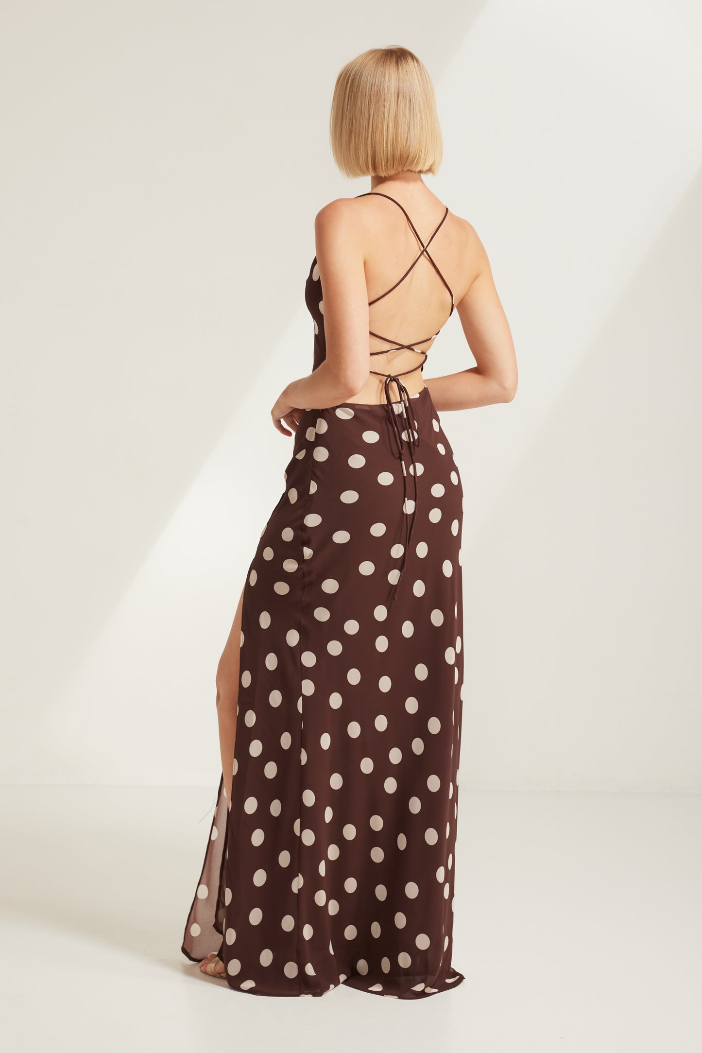TW4867 Cocoa Dot Edit Backless Maxi Dress in Choco/Beige. Wholesale dresses from Rosebullet The Label, a Melbourne based women's fashion wholesaler and manufacturer. Featuring elevated styles for every occasion, from casual dresses and workwear to parties, events, holidays, and evening wear